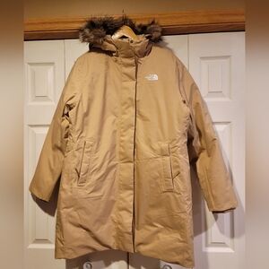 The North Face Beige Coat with Faux Fur Hood. New With No Tag.